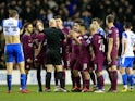City players argue with Anthony Taylor after Fabian Delph is sent off during the FA Cup game between Wigan Athletic and Manchester City on February 19, 2018