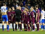 City players argue with Anthony Taylor after Fabian Delph is sent off during the FA Cup game between Wigan Athletic and Manchester City on February 19, 2018