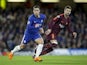 Eden Hazard and Gerard Pique in action during the Champions League group game between Chelsea and Barcelona on February 20, 2018