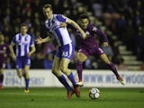 Ilkay Gundogan and Dan Burn in action during the FA Cup game between Wigan Athletic and Manchester City on February 19, 2018