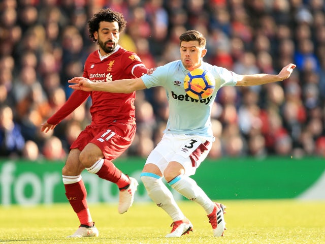 Mohamed Salah of Liverpool battles with Aaron Cresswell of West Ham United in the Premier League on February 24, 2018