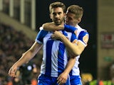 Will Grigg celebrates with Ryan Colclough after scoring during the FA Cup game between Wigan Athletic and Manchester City on February 19, 2018
