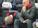 Arsene Wenger and Steve Bould watch on during the Premier League game between Brighton & Hove Albion and Arsenal on March 4, 2018