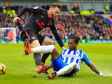 Calum Chambers and Gaetan Bong in action during the Premier League game between Brighton & Hove Albion and Arsenal on March 4, 2018