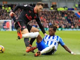 Calum Chambers and Gaetan Bong in action during the Premier League game between Brighton & Hove Albion and Arsenal on March 4, 2018