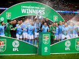 Manchester City players celebrate winning the EFL Cup on February 25, 2018