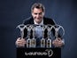 Roger Federer poses with his collection of Laureus Awards in February 2018