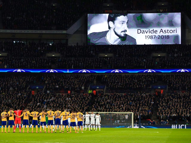 Tottenham Hotspur and Juventus players stand for a minute's silence in tribute to Fiorentina captain Davide Astori on March 7, 2018