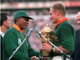 South Africa captain Francois Pienaar is given the William Webb Ellis Cup by president Nelson Mandela after winning the 1995 World Cup final