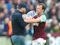 Mark Noble confronts a pitch invader during the Premier League game between West Ham United and Burnley on March 10, 2018
