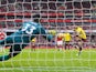 Petr Cech saves Troy Deeney's penalty during the Premier League game between Arsenal and Watford on March 11, 2018