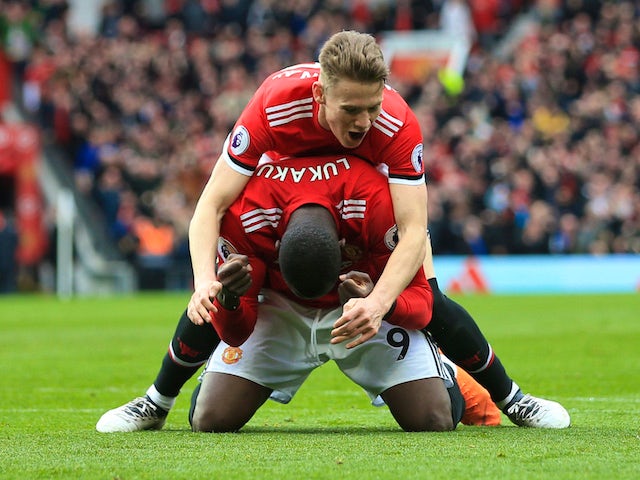 Scott McTominay and Romelu Lukaku in action during the Premier League game between Manchester United and Liverpool on March 10, 2018