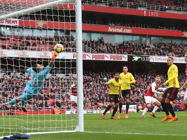 Shkodran Mustafi scores the opener during the Premier League game between Arsenal and Watford on March 11, 2018