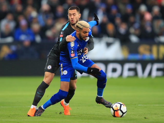 Eden Hazard grapples with Riyad Mahrez during the FA Cup quarter-final between Leicester City and Chelsea on March 18, 2018