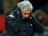 Jose Mourinho covers his ears during the FA Cup quarter-final between Manchester United and Brighton & Hove Albion on March 17, 2018