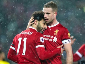 Mohamed Salah is embraced by Jordan Henderson during the Premier League game between Liverpool and Watford on March 17, 2018