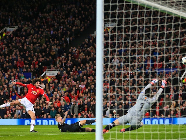 Sergio Rico saves a shot from Marouane Fellaini during the Champions League round-of-16 game between Manchester United and Sevilla on March 13, 2018
