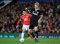Simon Kjaer is pursued by Alexis Sanchez during the Champions League round-of-16 game between Manchester United and Sevilla on March 13, 2018