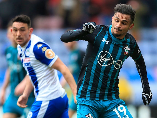 Sofiane Boufal and Gary Roberts in action during the FA Cup quarter-final between Wigan Athletic and Southampton on March 18, 2018