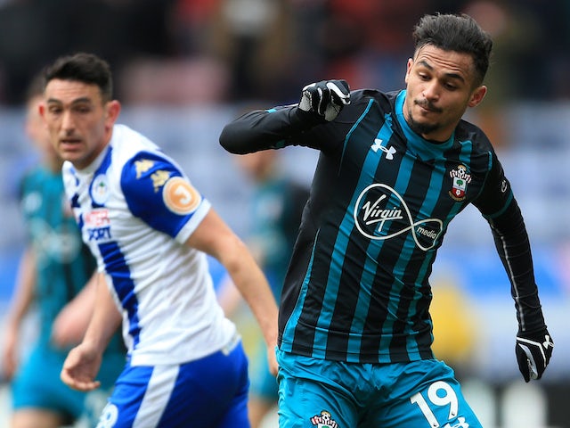 Sofiane Boufal and Gary Roberts in action during the FA Cup quarter-final between Wigan Athletic and Southampton on March 18, 2018