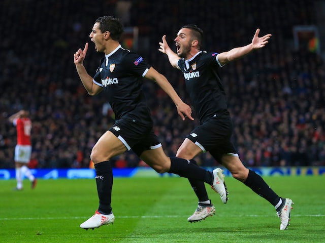 Wissam Ben Yedder celebrates scoring with Pablo Sarabia during the Champions League round-of-16 game between Manchester United and Sevilla on March 13, 2018