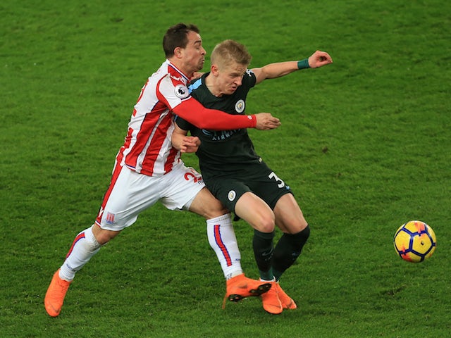 Xherdan Shaqiri and Oleksandr Zinchenko in action during the Premier League game between Stoke City and Manchester City on March 12, 2018