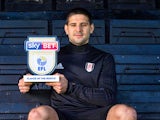 Fulham striker Aleksandar Mitrovic poses with his Championship player of the month award for March 2018