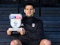 Fulham striker Aleksandar Mitrovic poses with his Championship player of the month award for March 2018