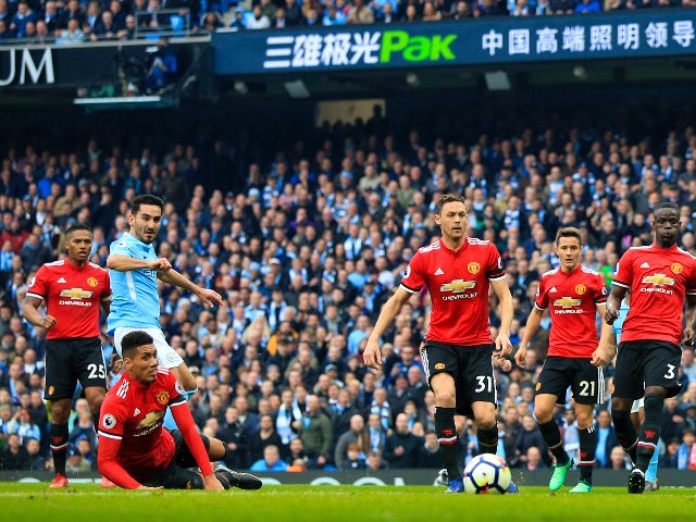 Ilkay Gundogan scores Manchester City's second goal against Manchester United on April 7, 2018