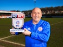 Accrington Stanley manager John Coleman poses with the League Two manager of the month award for March 2018