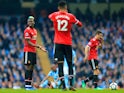 Paul Pogba looks dejected during the Premier League match between Manchester City and Manchester United on April 7, 2018