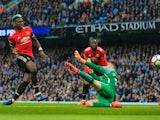 Paul Pogba scores during the game between Manchester City and Manchester United on April 7, 2018