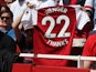 A shirt paying tribute to Arsene Wenger held by a supporter during the Premier League game between Arsenal and West Ham United on April 22, 2018