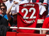 A shirt paying tribute to Arsene Wenger held by a supporter during the Premier League game between Arsenal and West Ham United on April 22, 2018