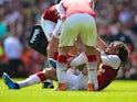 An injured Mohamed Elneny during the Premier League match between Arsenal and West Ham United on April 22, 2018