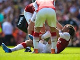 An injured Mohamed Elneny during the Premier League match between Arsenal and West Ham United on April 22, 2018