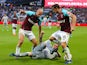 Pablo Zabaleta and Mark Noble of West Ham in action with Phil Jones of Manchester United on May 10, 2018