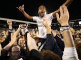 Match-winner Denis Odoi celebrates with fans after the Championship playoff semi-final between Fulham and Derby County on May 14, 2018