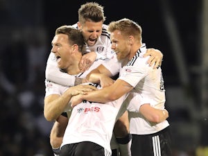 Kevin McDonald, Oliver Norwood, Tomas Kalas and Tim Ream celebrate after the Championship playoff semi-final between Fulham and Derby County on May 14, 2018