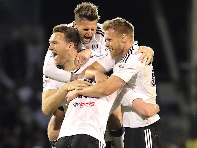 Kevin McDonald, Oliver Norwood, Tomas Kalas and Tim Ream celebrate after the Championship playoff semi-final between Fulham and Derby County on May 14, 2018