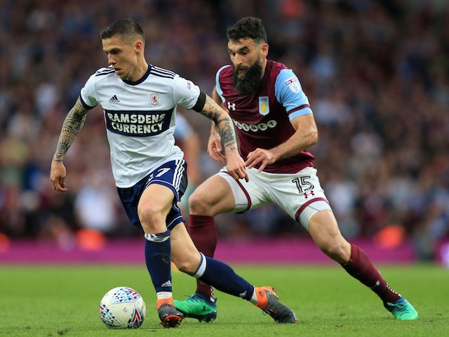 Muhamed Besic and Mile Jedinak in action during the Championship playoff semi-final between Aston Villa and Middlesbrough on May 15, 2018