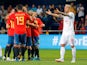 Spain's Alvaro Odriozola celebrates scoring their first goal with teammates as Switzerland's Valon Behrami reacts