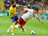 Sweden's Jimmy Durmaz brings down Denmark's Thomas Delaney during a friendly on June 2, 2018