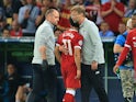 Mohamed Salah receives a hug from Jurgen Klopp after he comes off injured during the Champions League final between Real Madrid and Liverpool on May 26, 2018