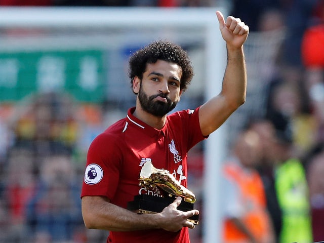 Liverpool's Mohamed Salah holding his golden boot on May 13, 2018