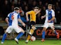 Blackburn Rovers' Grant Hanley and Tommy Spurr in action with Newport County's Aaron Collins on January 18, 2016