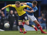 Portsmouth's Ben Close in action with Oxford United's Joe Rothwell on March 25, 2018