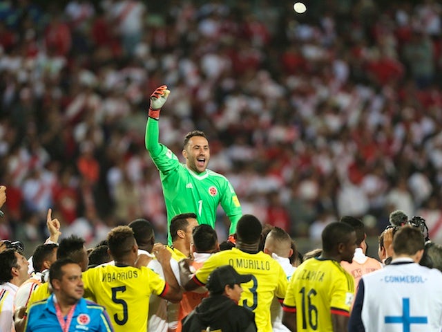 Colombia goalkeeper David Ospina leads the celebrations as his side qualify for the World Cup following a 1-1 draw with Peru