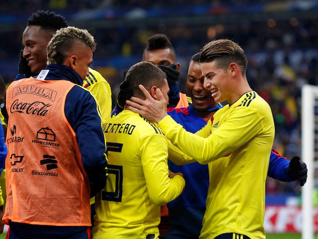 Colombia's Juan Quintero celebrates scoring their third goal from the penalty spot with teammates during an international friendly with France in March 2018