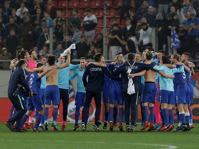 The Croatia players celebrate after securing their place at the 2018 World Cup